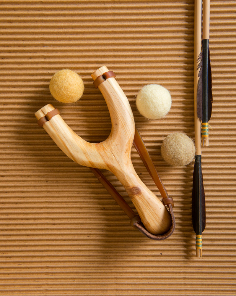 slingshot catapult wooden toy handmade felt ball vegetable dyed waldorf toy open ended toy natural materials toys for boys