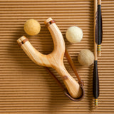 slingshot catapult wooden toy handmade felt ball vegetable dyed waldorf toy open ended toy natural materials toys for boys