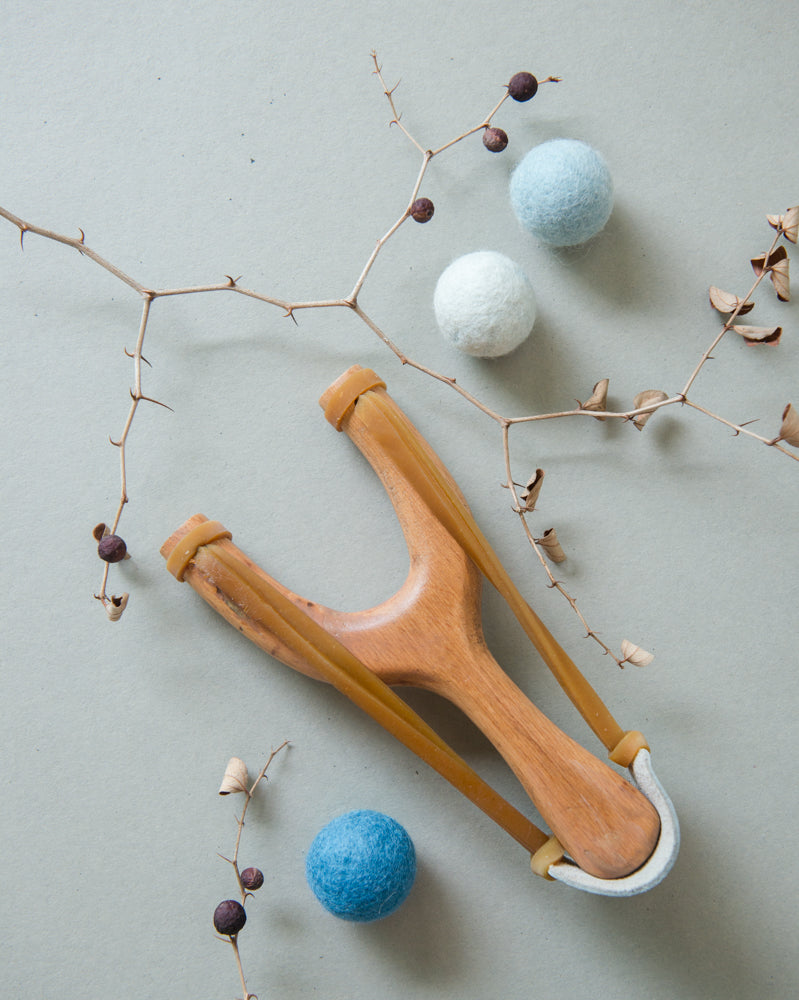 slingshot catapult wooden toy handmade felt ball vegetable dyed waldorf toy open ended toy natural materials natural colourstoys for boys