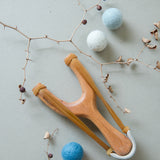 slingshot catapult wooden toy handmade felt ball vegetable dyed waldorf toy open ended toy natural materials natural colourstoys for boys