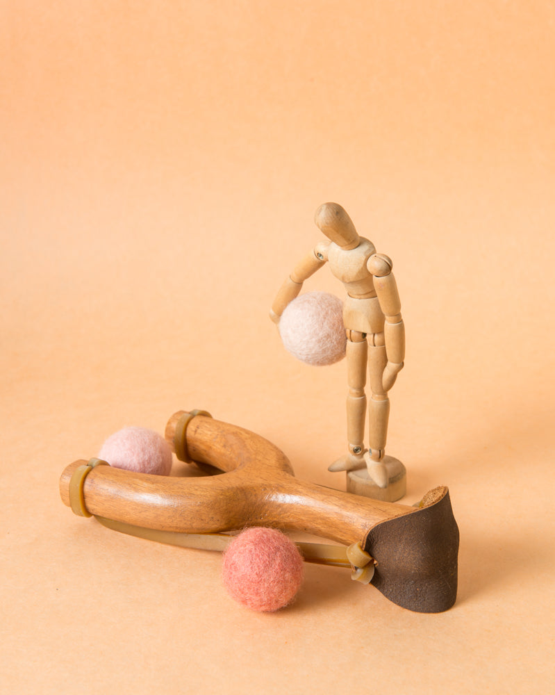 slingshot catapult wooden toy handmade felt ball vegetable dyed waldorf toy open ended toy natural materials toys for boys