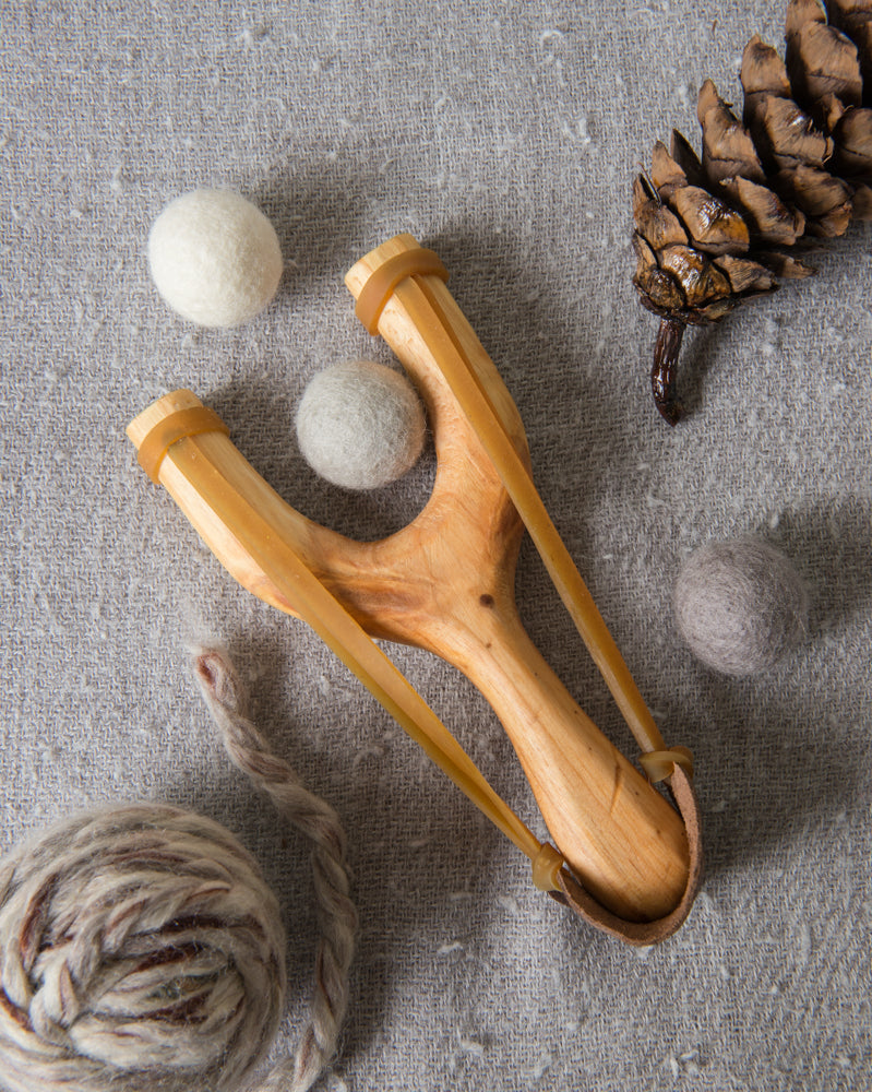 slingshot catapult wooden toy handmade felt ball vegetable dyed waldorf toy open ended toy natural materials toys for boys