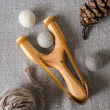 slingshot catapult wooden toy handmade felt ball vegetable dyed waldorf toy open ended toy natural materials toys for boys