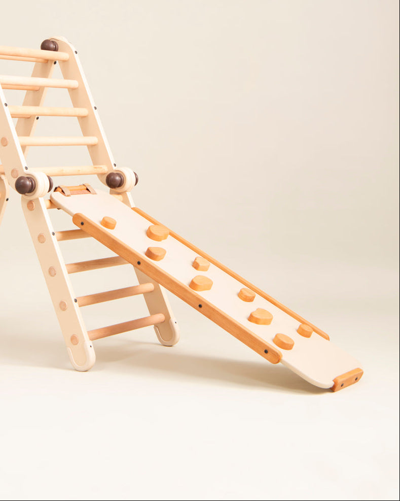 Wooden climbing toy with ladder and slide on a beige background