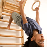 Keya on the transformable pikler jungle gym with gymnastics ring 